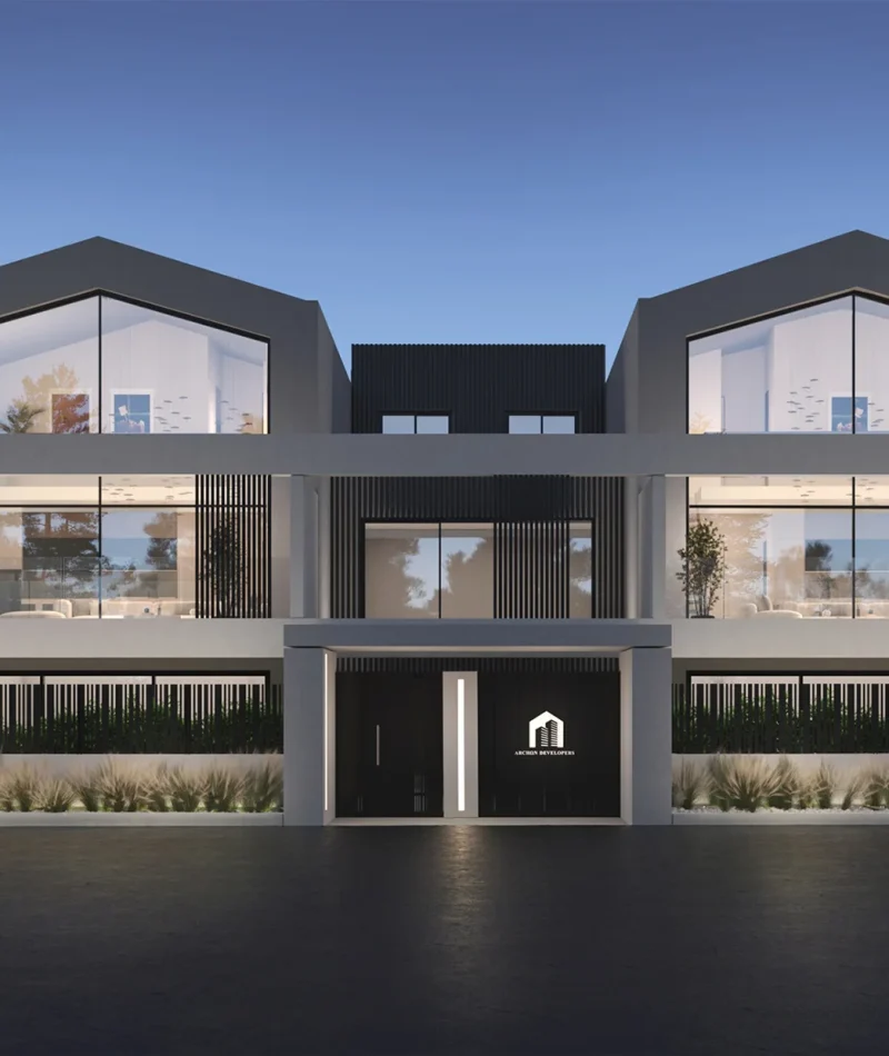 Σύγχρονη πολυκατοικία με συμμετρικούς όγκους, μεγάλες υαλοστάσεις και γραμμικά μπαλκόνια – εξωτερική όψη ημέρας.